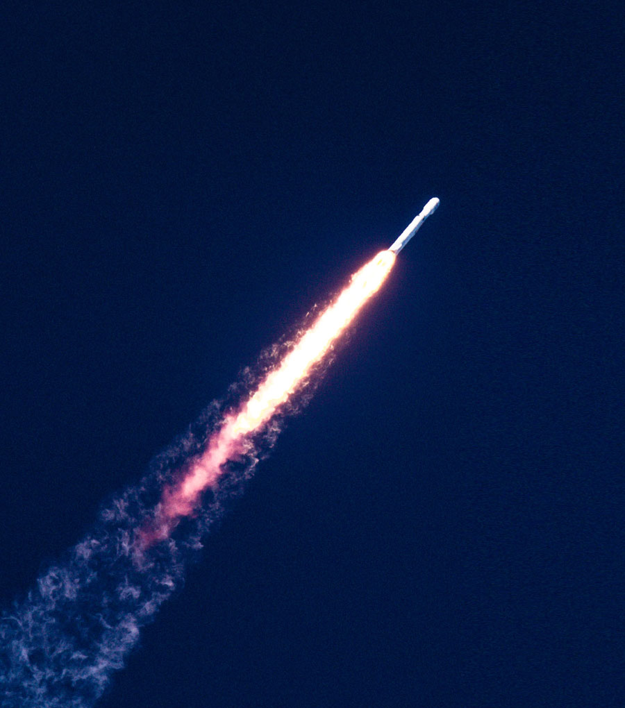 Photo of a rocket blasting through the sky at full speed